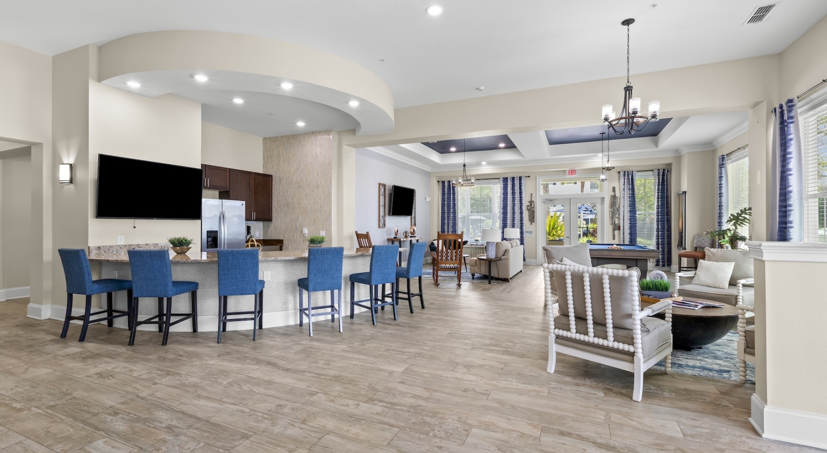 Access to resident-only features a spacious lounge with blue bar stools