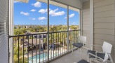 a spacious balcony with chairs