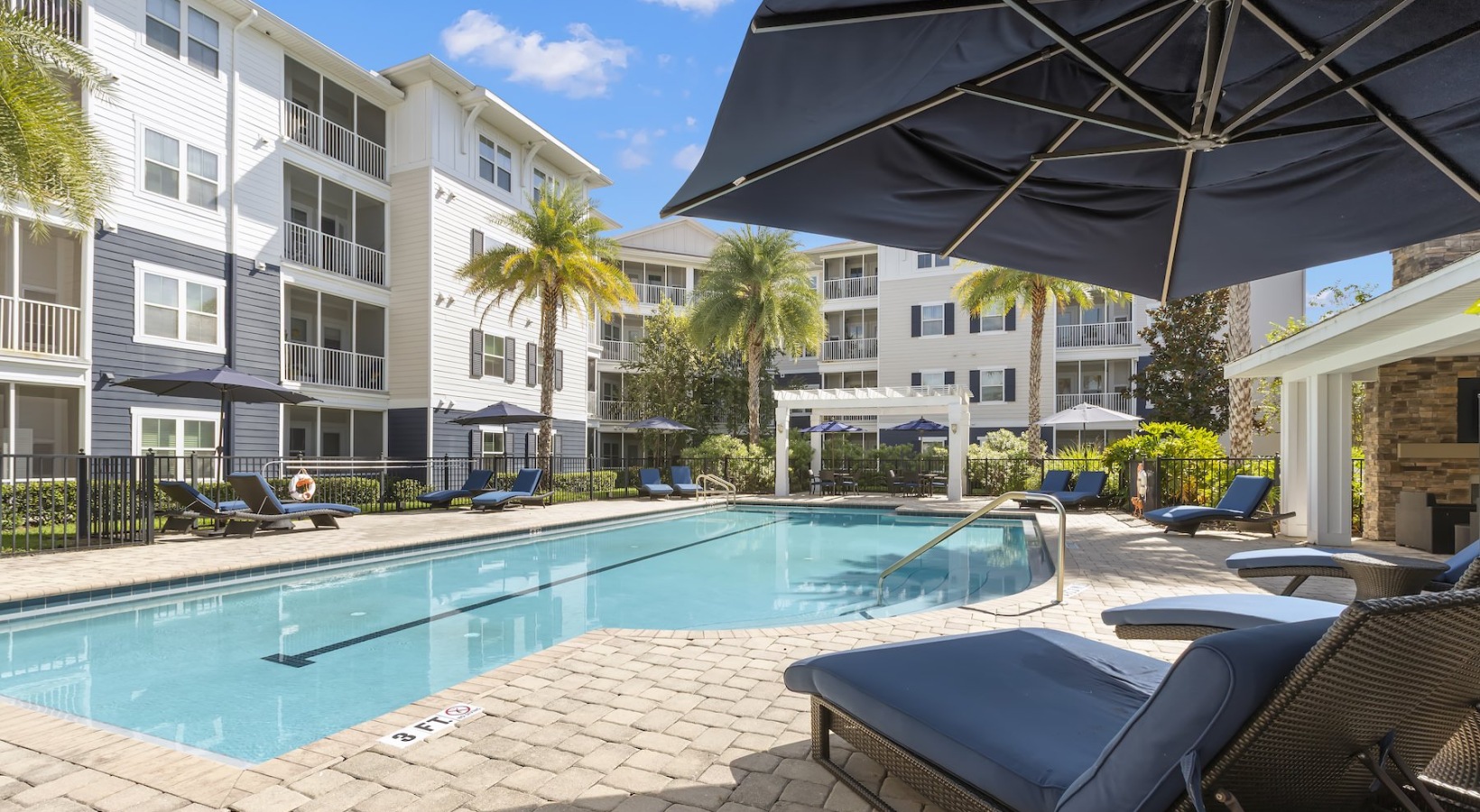 Quick access to state-of-the-art amenities Resort-style swimming pool with lounge seating