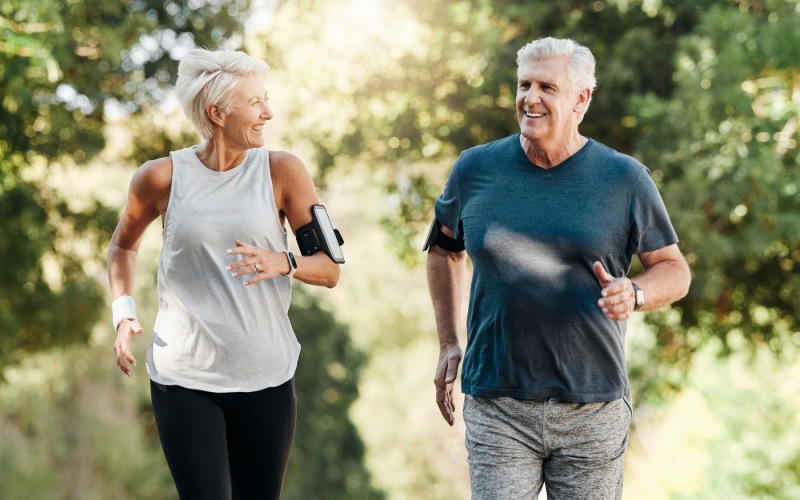 a man and a woman jogging outdoors