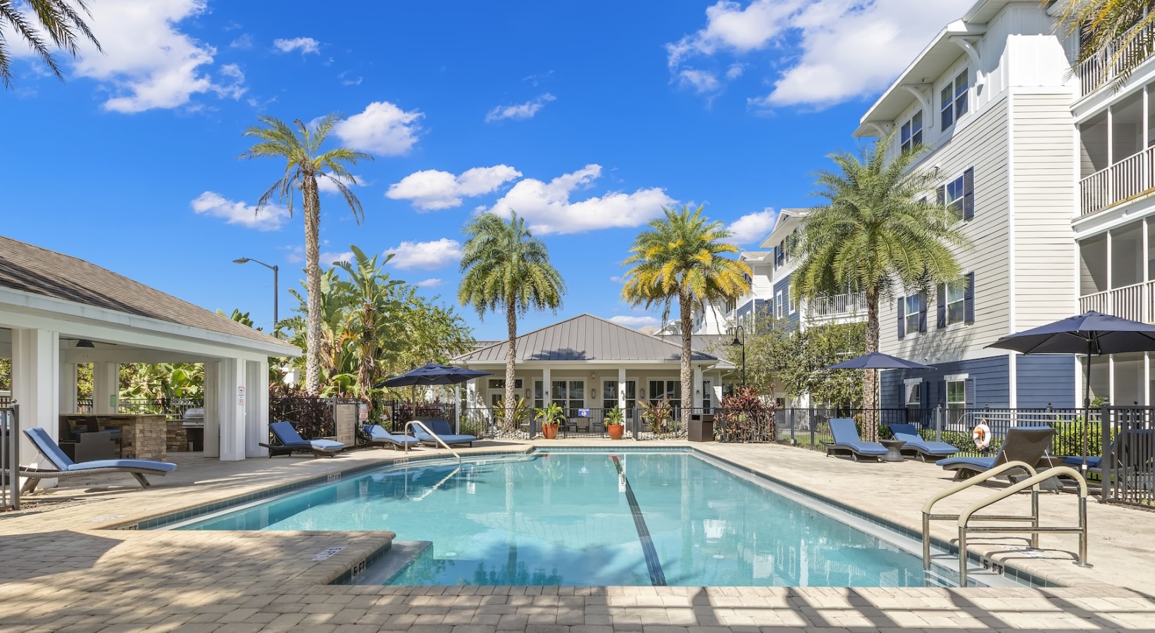Relax and unwind poolside Resort-style swimming pool with lounge seating