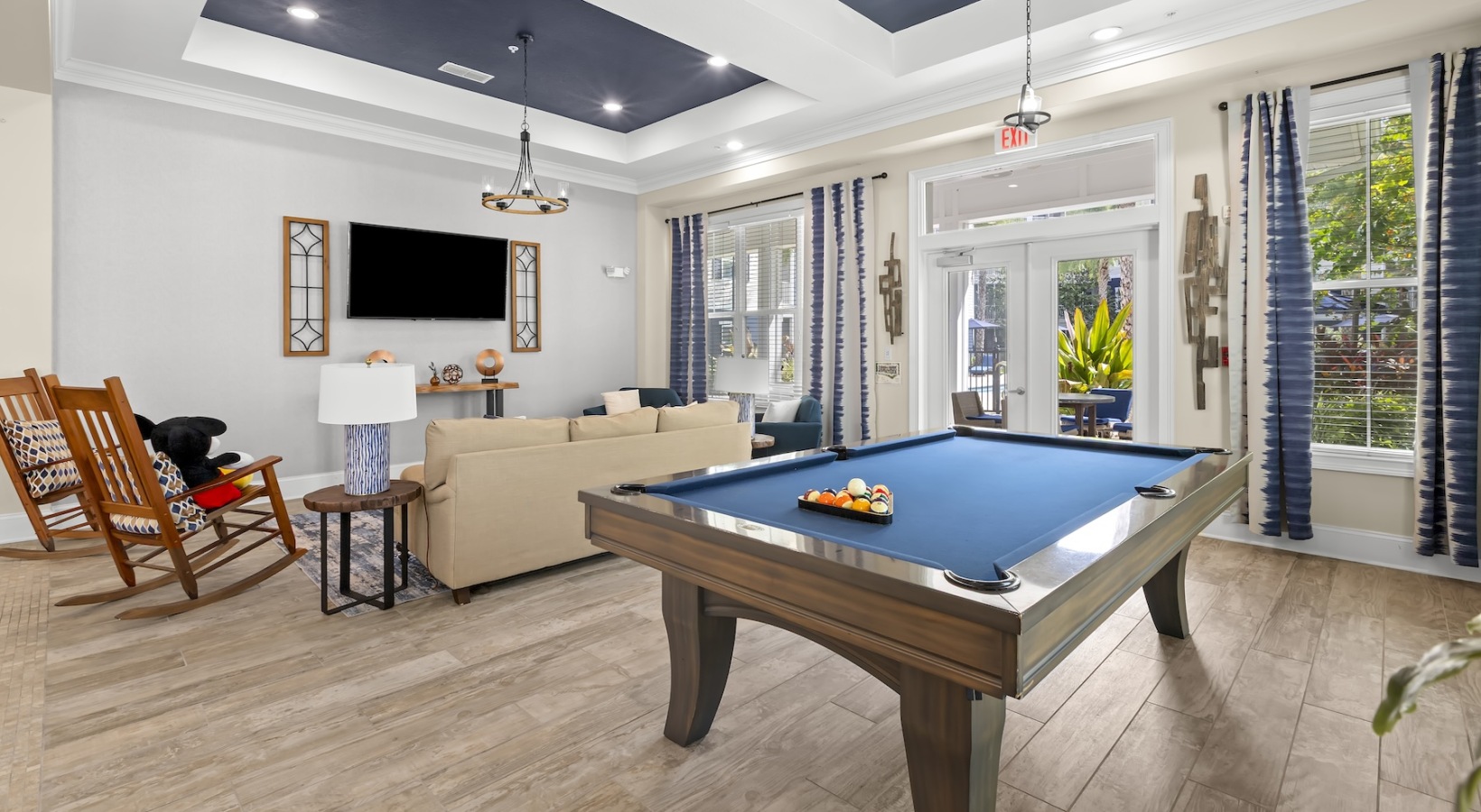 Cutting-edge amenities at your fingertips Beautiful clubroom with lounge seating and gaming areas