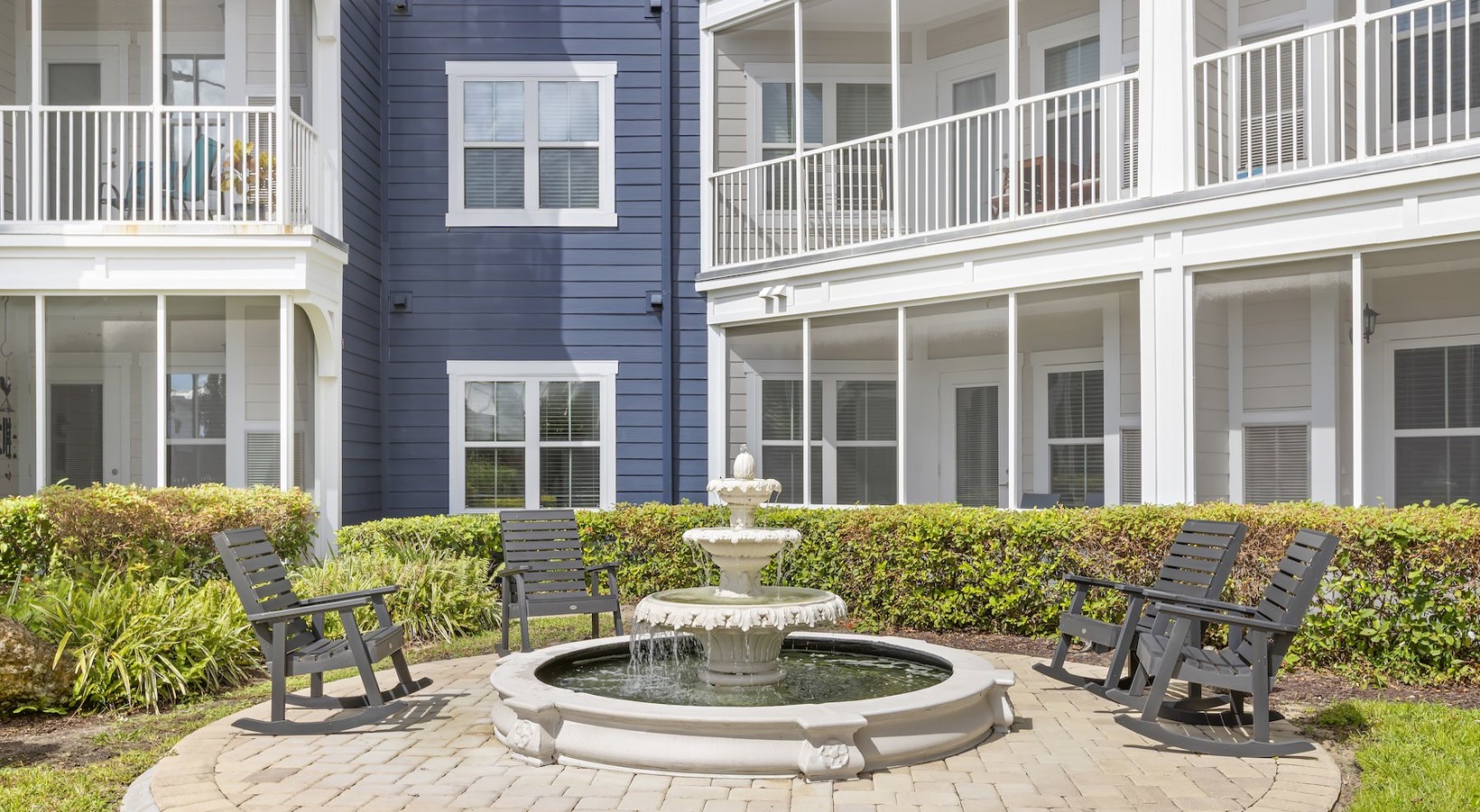 Enjoy our resident-only features Adirondack chairs near a fountain