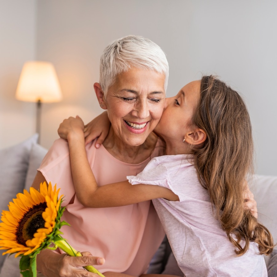 Love where you live a little girl hugging her grandma and smiling