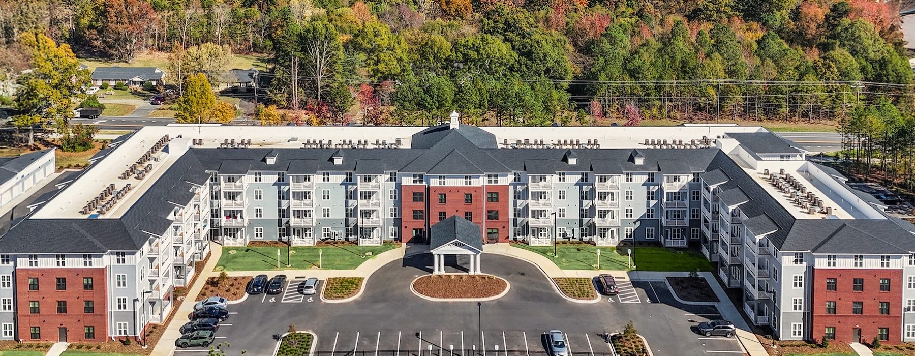 a building surrounded by autumn trees