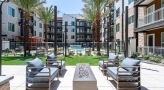 an outdoor seating area with a fire pit
