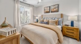 Bedroom with natural lighting and high ceilings