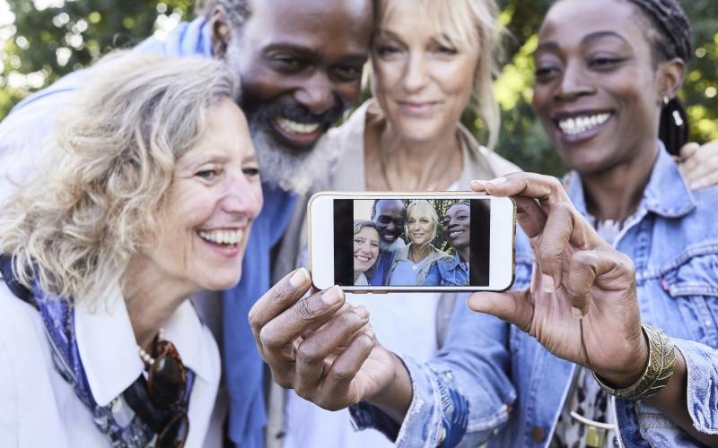 a group of people taking a selfie