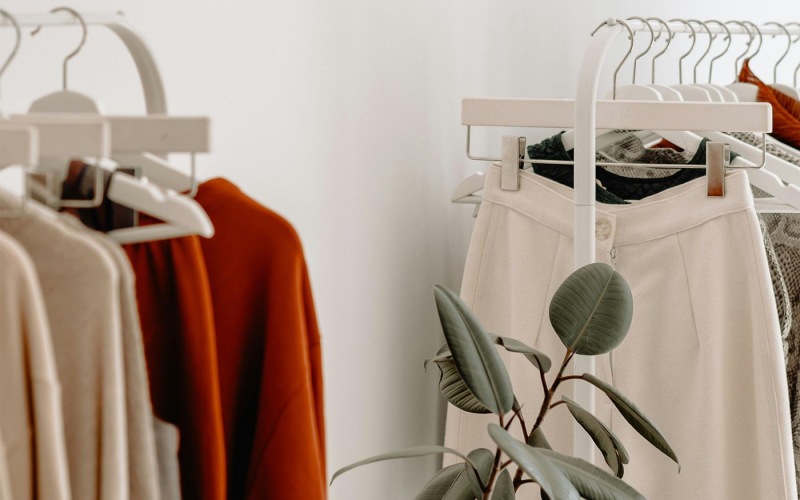 Vibrant community life with a variety of shopping options clothes on a rack near a plant