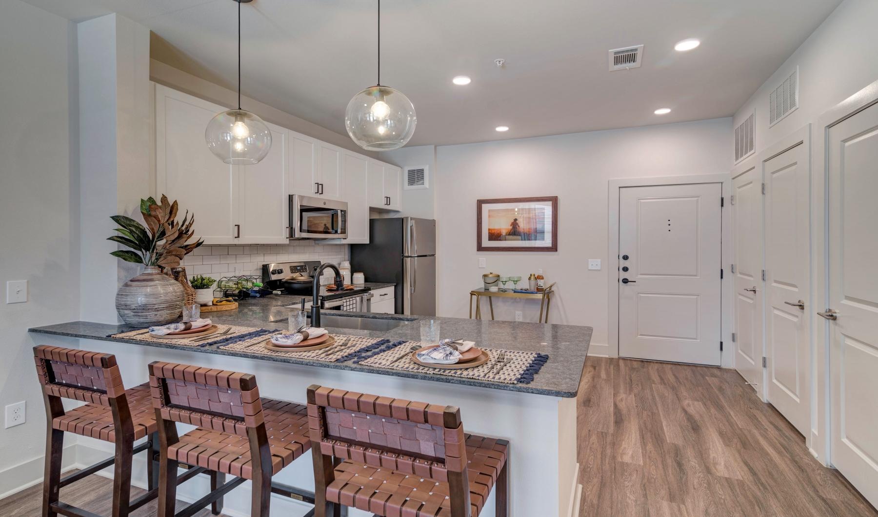 The essence of exceptional living a kitchen with a dining table and chairs