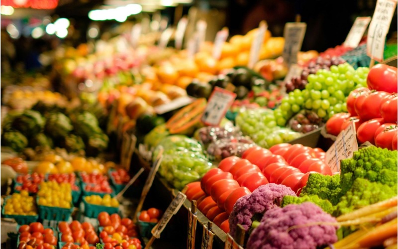 Vibrant community life with a variety of shopping options a market with vegetables and fruits