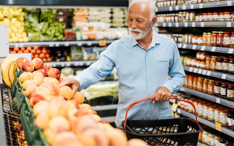 The essence of exceptional living a person holding a shopping cart in a grocery store