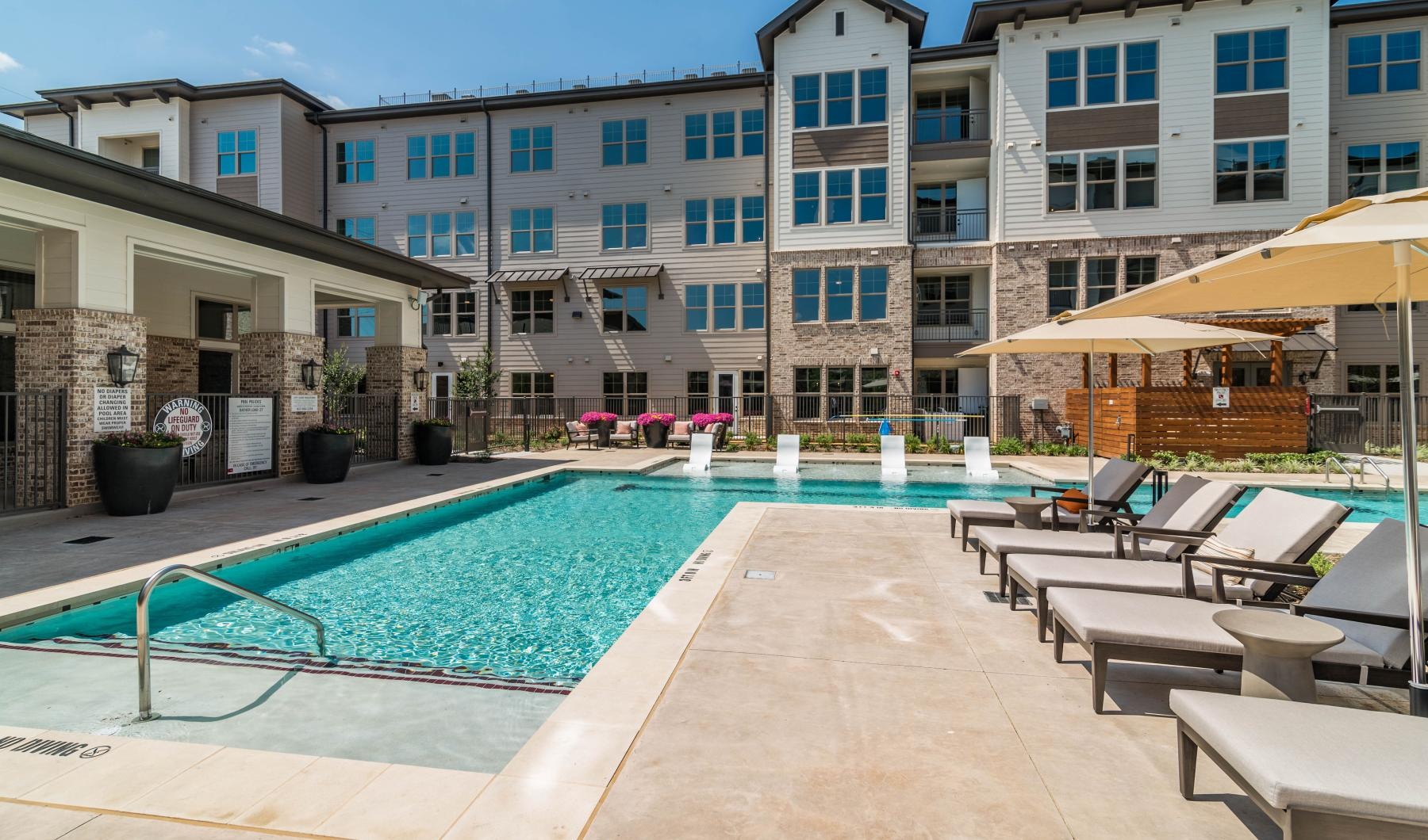 Resort-style swimming pool a pool in a courtyard