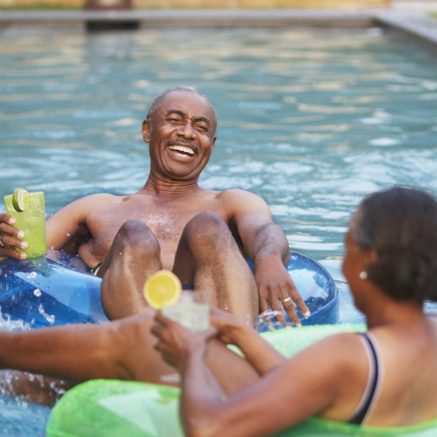 Resort-style swimming pool a man and a woman in a pool