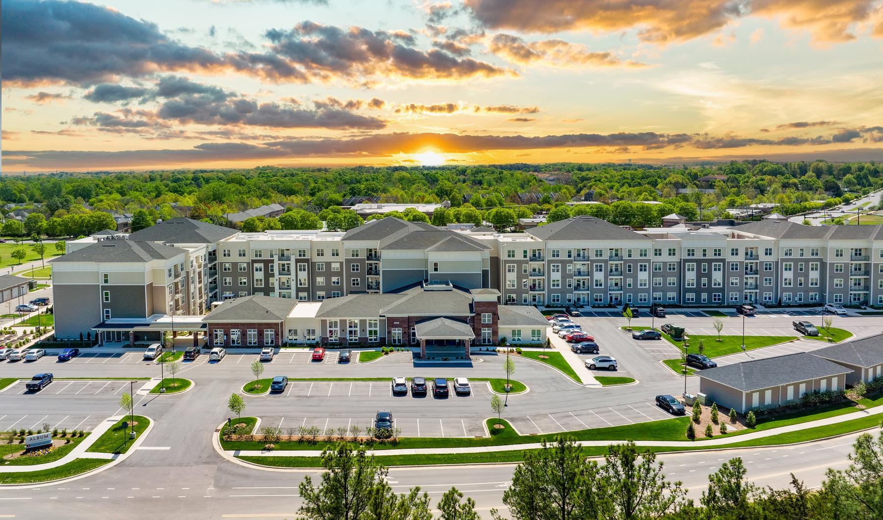 The essence of exceptional living Exterior view of Album Huntersville active adult apartments.