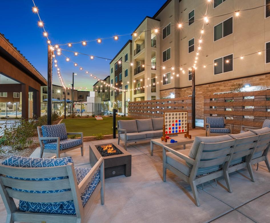 a patio with chairs and tables outside