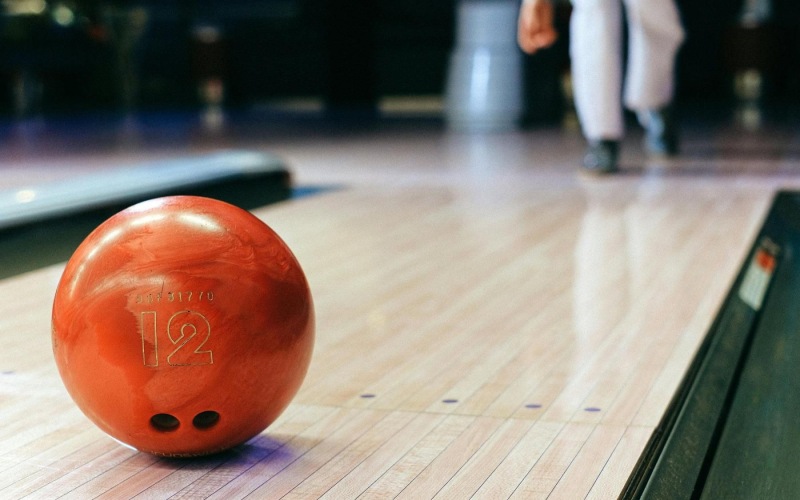A new standard of living a bowling ball on a bowling alley
