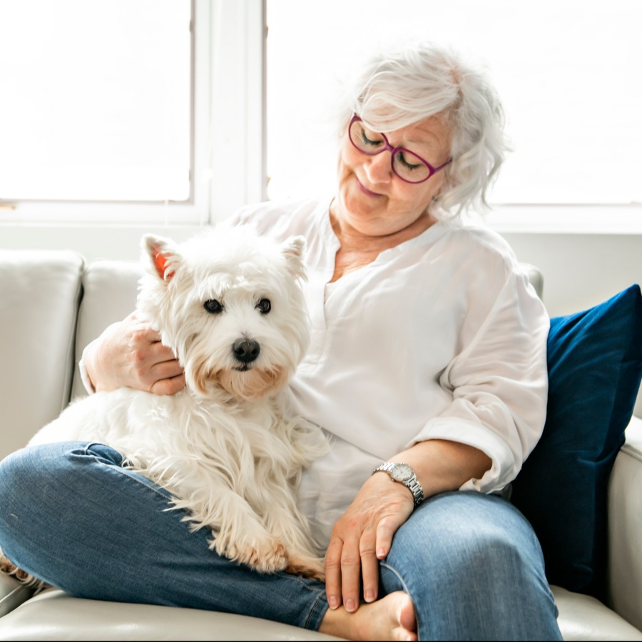 a woman holding her dog