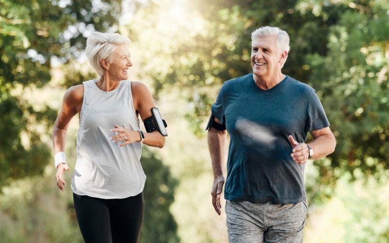 Close to the center of everything a man and a woman jogging outdoors