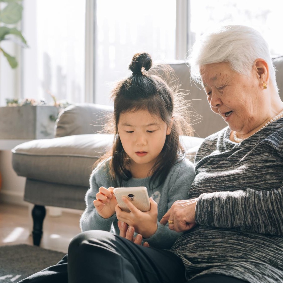 The essence of exceptional living a woman and a child looking at a phone