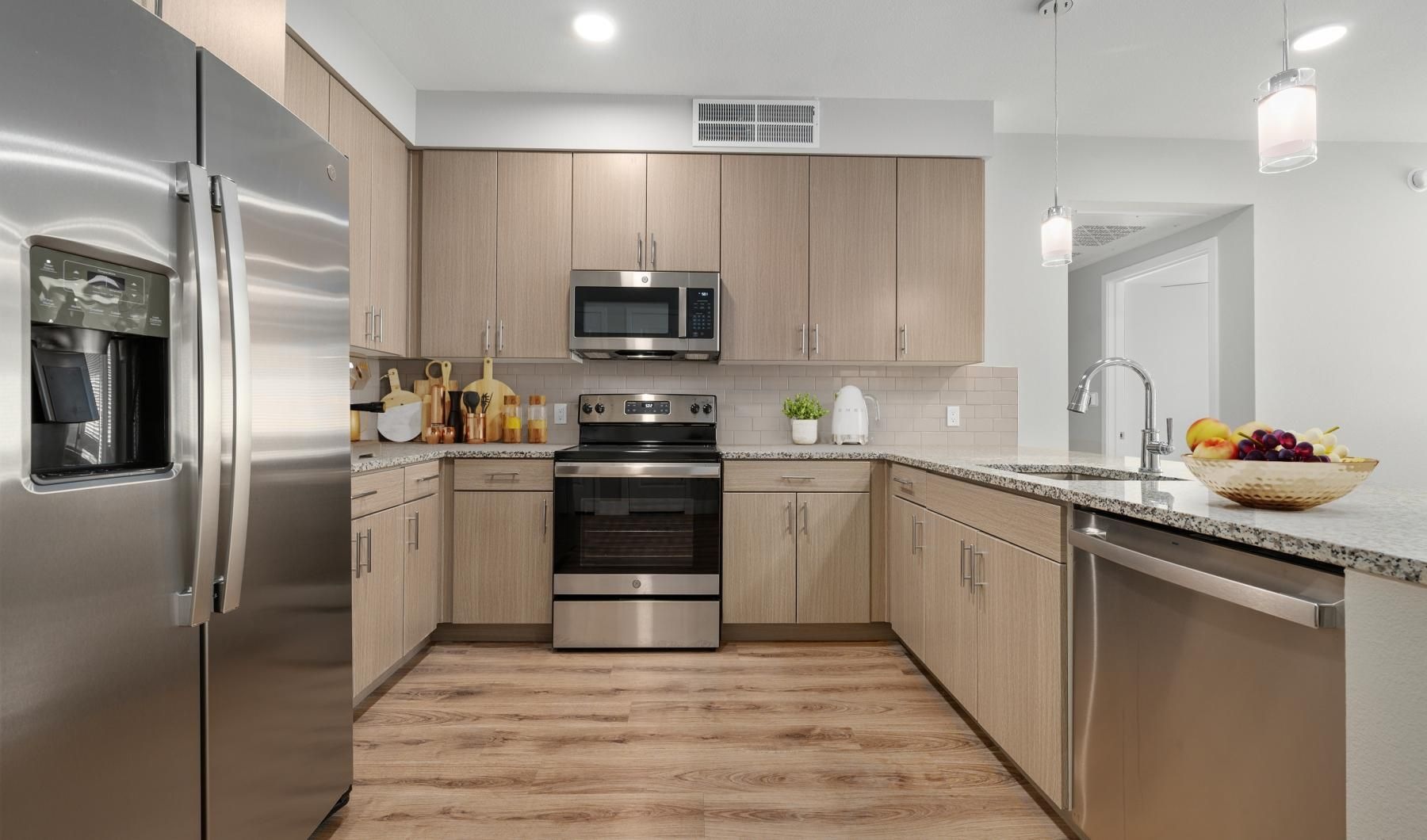 Spacious kitchens with thoughtful details a kitchen with stainless steel appliances