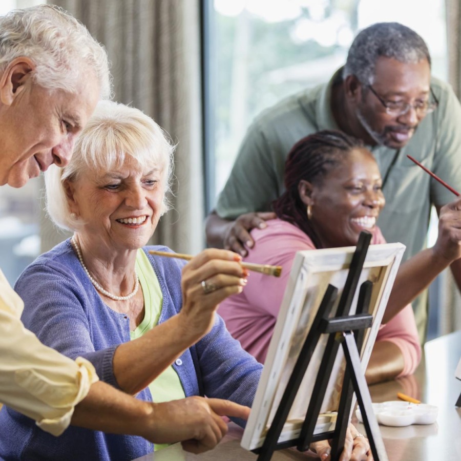 a group of people painting