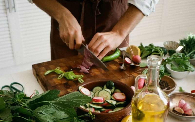 a person cutting vegetables