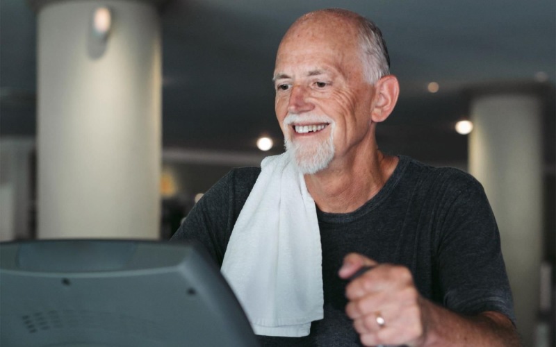The essence of exceptional living a man working out on an elliptical