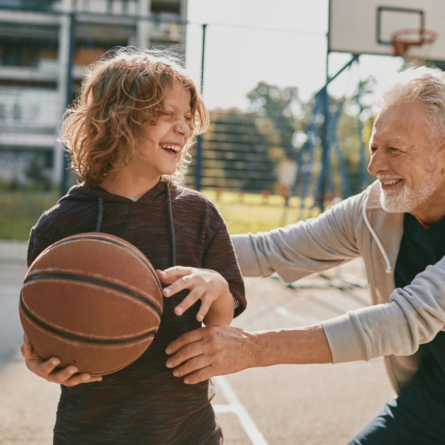The essence of exceptional living a man and a woman holding a basketball