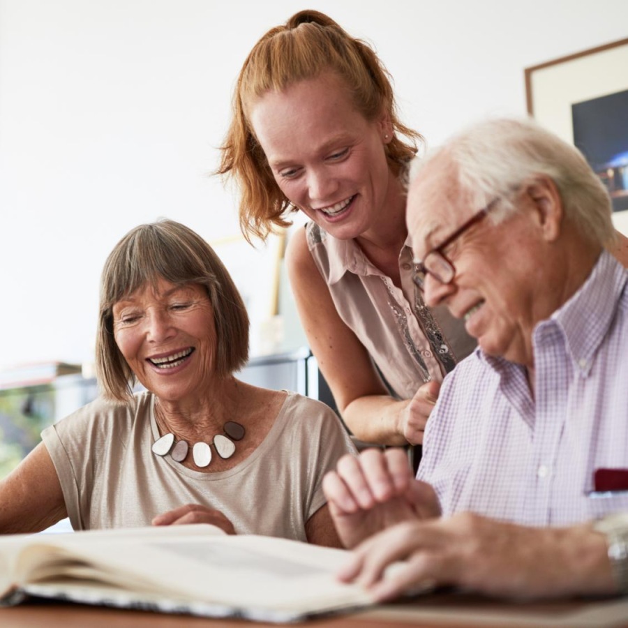 Find your perfect fit at Album Indian Lake a group of people looking at a book